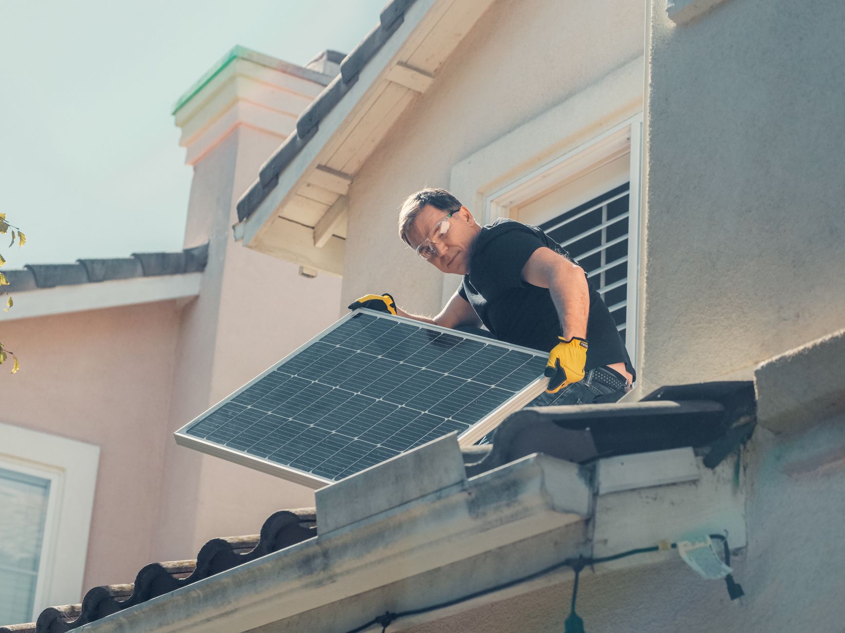 A friendly roofing contractor from Bonita Roof Replacement & Repairs shaking hands with a homeowner in front of a newly repaired roof in Coronado.