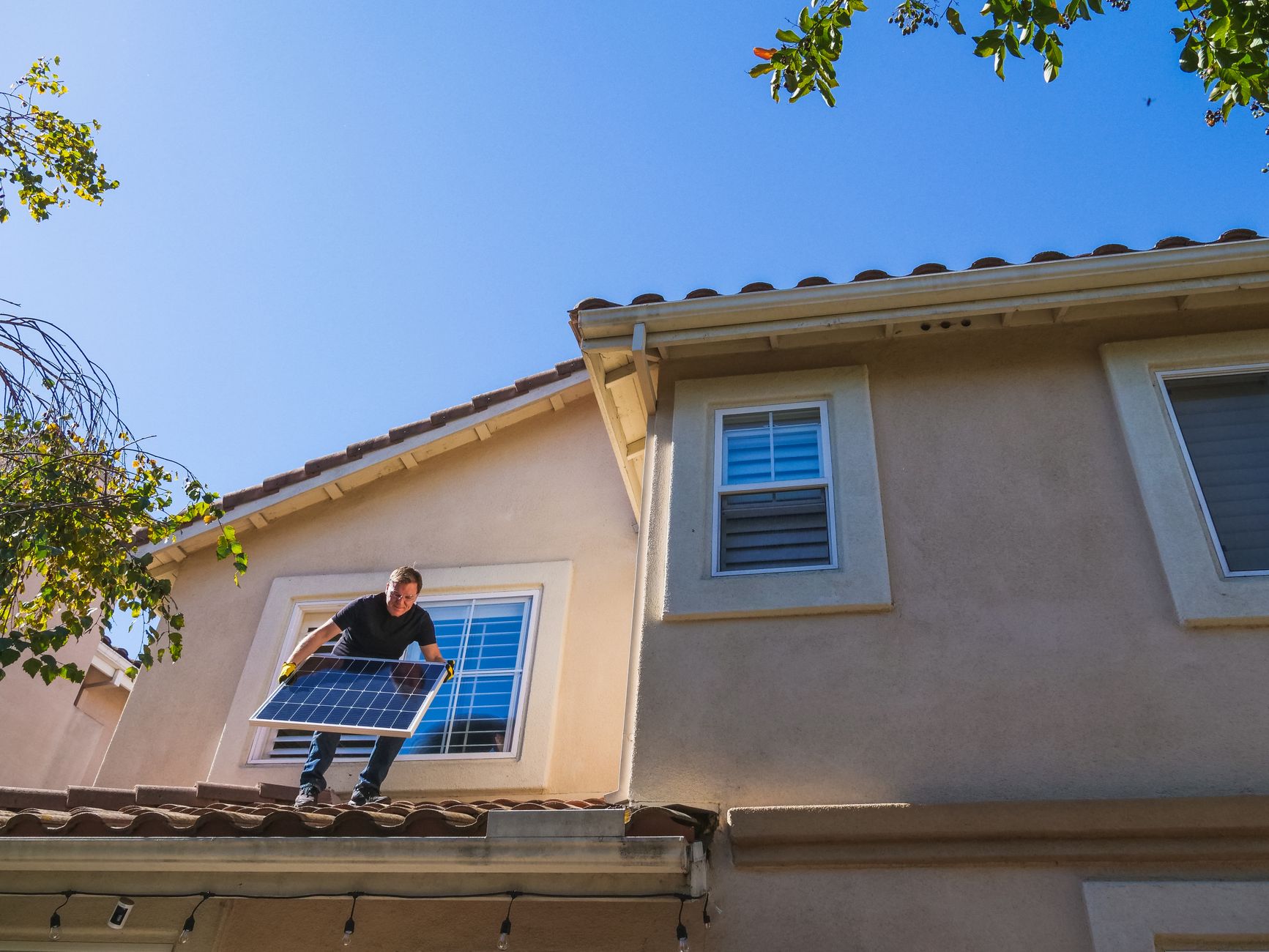 A professional roofing contractor from Bonita Roof Replacement & Repairs discussing roof repair options with a homeowner in front of their Poway residence.